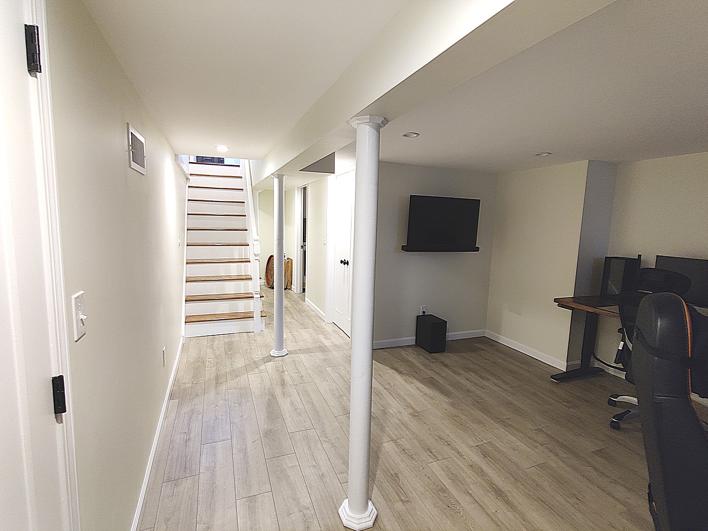 Basement renovation with lounge seating