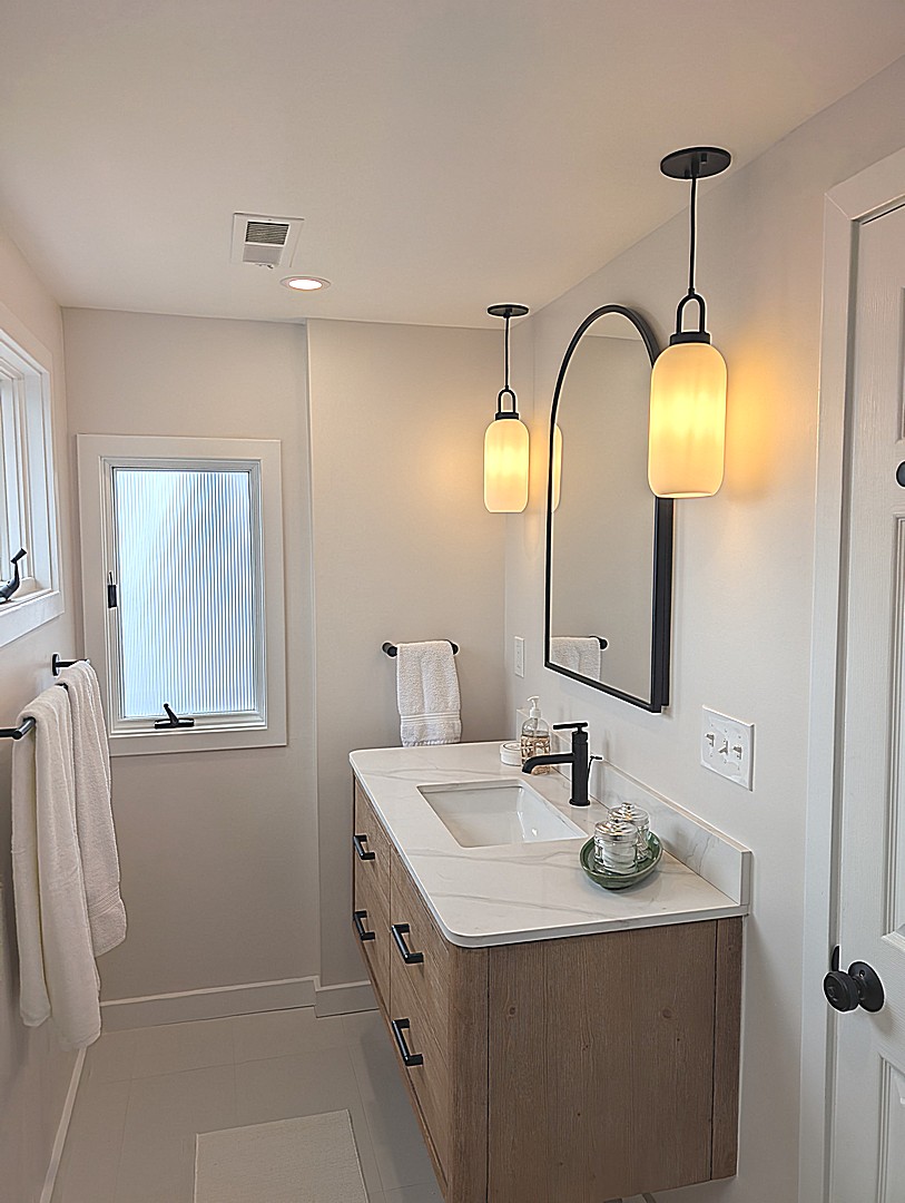 Bathroom renovation with layered lighting