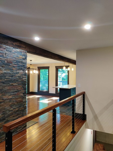 View of living room from custom staircase